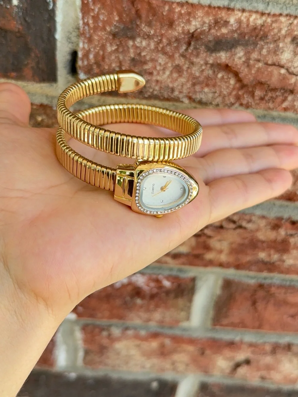 Gold serpentine bracelet watch